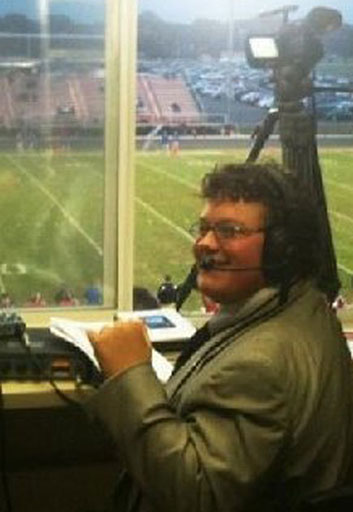 Jimmy in broadcast booth at school