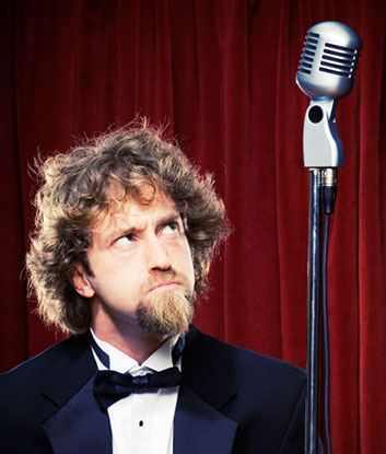 Josh Blue stares at mic