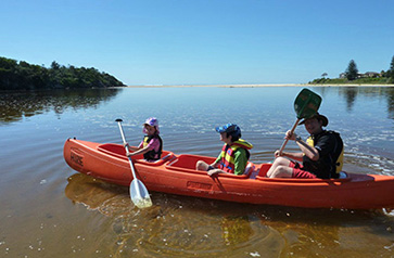 The Jones' family canoes at lake