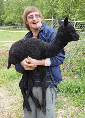 Jack Runser holding alpaca