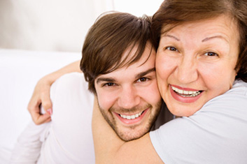 mother hugging adult daughter