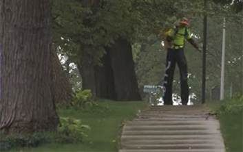 Neil walking down sidewalk