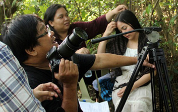 Ron Sapinoso prepping scene for shoot