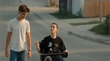 Friends talking while strolling down the street