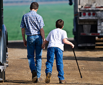 boys walking on dirt path