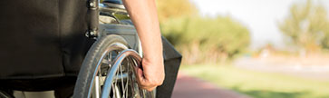 a man in a wheelchair traveling an wonderful road